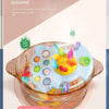 A glass bowl filled with colorful, soft sensory toys for babies and toddlers