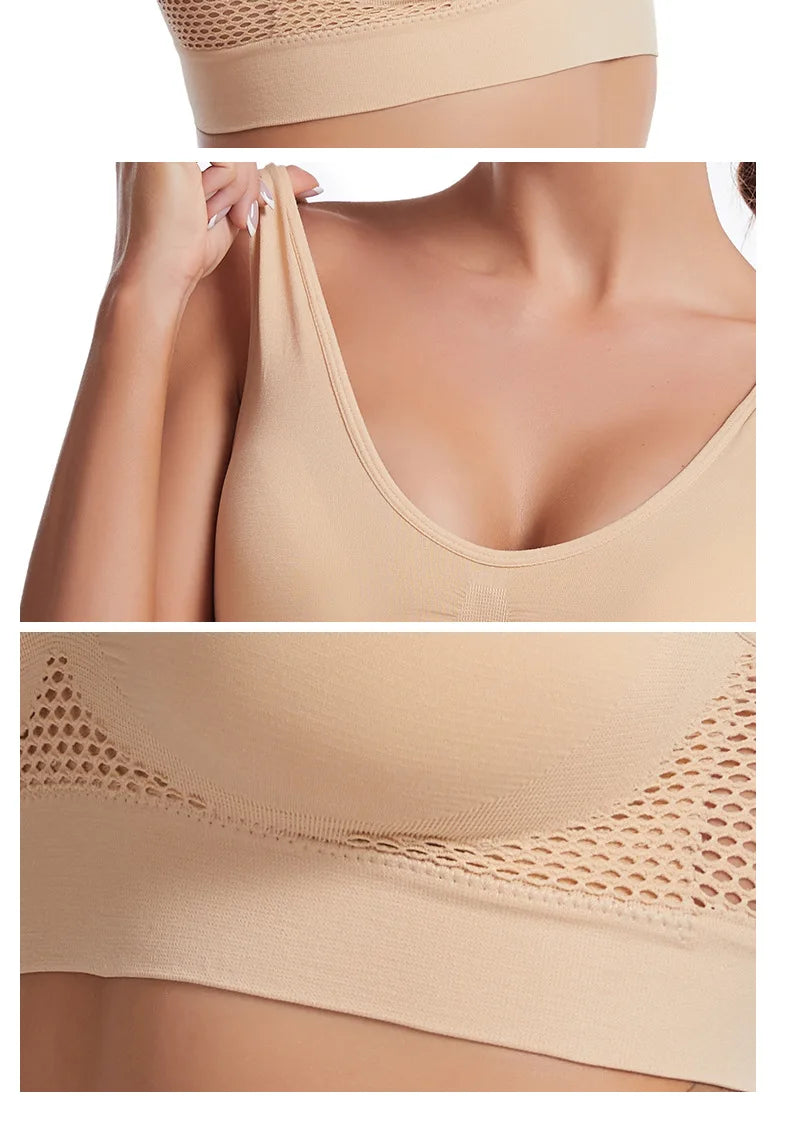 A beige breathable plus size sports bra featuring a V-neckline and mesh detailing.