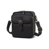 Black vintage vegan leather messenger bag with a gold-toned clasp and adjustable strap.