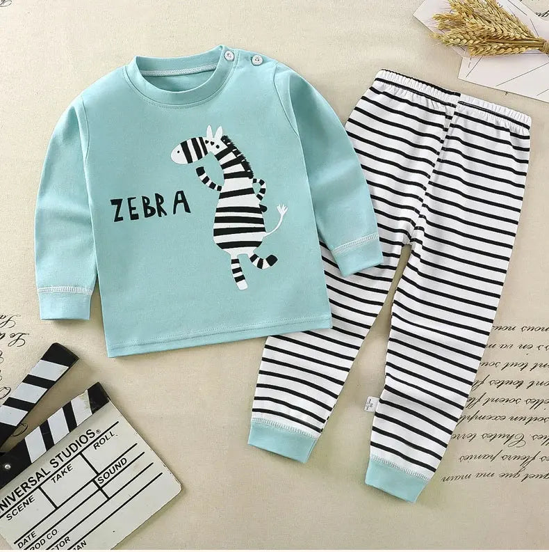Light blue long sleeve shirt and matching striped pants featuring a zebra print for a child