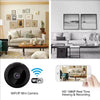 A black WiFi IP mini camera is shown next to a smartphone displaying live HD video monitoring.