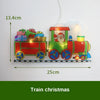 An LED train Christmas decoration featuring Santa Claus and gifts, suspended by a thin wire.