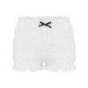 White ruffled tiered shorts with a black bow detail