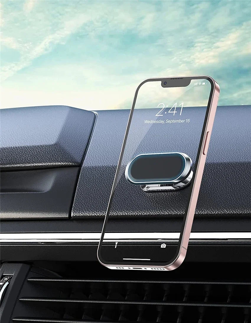 A pink smartphone is mounted on a black car dashboard, displaying the time 2:41.