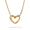 A dainty gold heart pendant necklace featuring a snake chain.