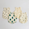 A set of three cream-colored baby cotton sleeveless bodysuits featuring small dark leaves and fruit patterns.
