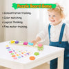 A toddler is playing with a colorful magnetic caterpillar puzzle board game on a white table.