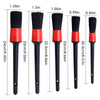 A set of five black detailing brushes with red bases and varying sizes, shown vertically.