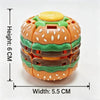 An orange hamburger-shaped fidget ball with green accents and a yellow top, designed for stress relief.