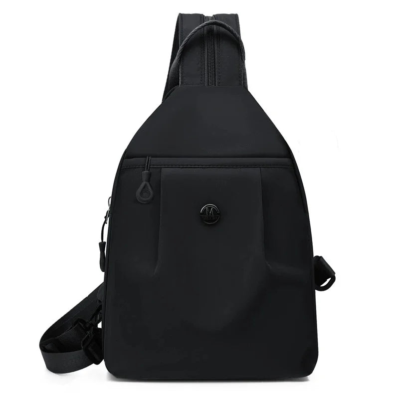 Black lightweight Oxford cloth mini backpack shown from the back
