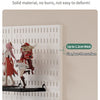 A white modular wall pegboard storage panel with hooks and a shelf, featuring a thick material for strong support.