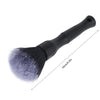 A black detailing brush with a wide, soft bristles and a handle, shown against a white background.