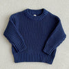 A navy blue knit baby pullover sweater with a ribbed texture shown flat lay.
