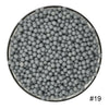 A circular view of a large quantity of gray water beads.