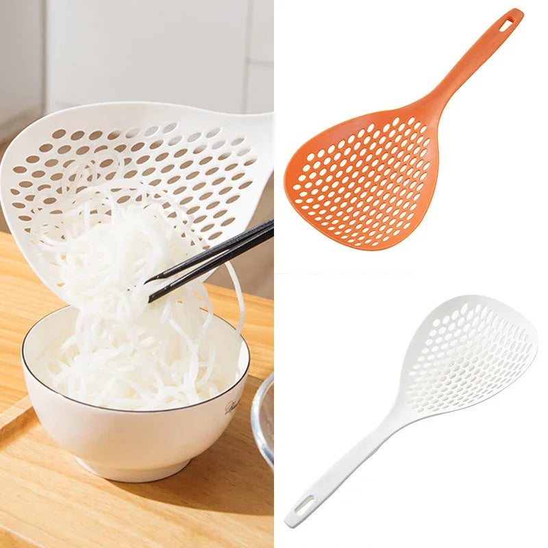 Two kitchen strainers or spatulas are shown: an orange perforated spoon and a white perforated spoon.