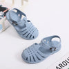 Light blue kids' Roman Gladiator jelly sandals with non-slip soles shown on a white background.