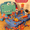 A blue plastic toolbox holds an electric drill and various tools for a pretend play repair kit.