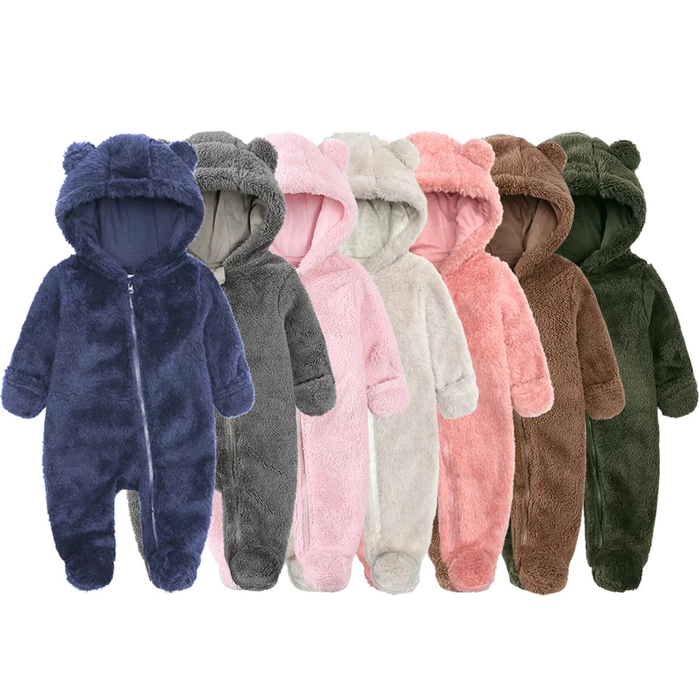 A row of baby fleece hooded rompers in various colors including blue, gray, pink, beige, and brown.