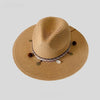 A wide-brim straw sun hat in a natural tan color with braided trim and decorative beads.
