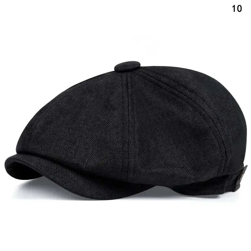 Black vintage retro newsboy cap with a folded brim shown from the side.