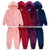 A set of kids velvet tracksuit including a hooded zipper jacket and matching pants in various shades of pink, red, purple, an