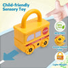 A yellow school bus shaped sensory toy with a handle and round wheels, demonstrating a stop function.