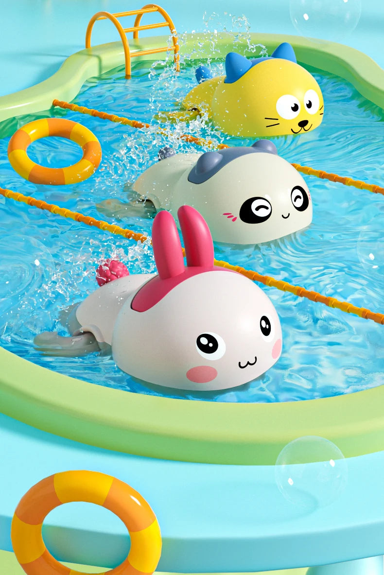 Cute duck and penguin bath toys being used in a blue water pool.
