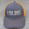 A dark gray baseball cap with an orange brim and embroidered text that reads IFIX SHIT THAT'S WHAT I DO