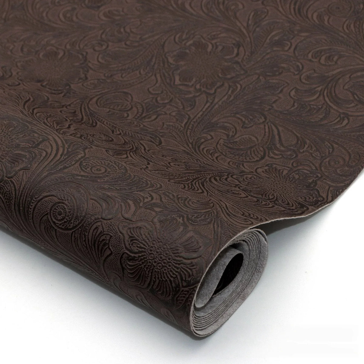 Roll of dark brown vintage floral textured faux leather fabric for crafting projects
