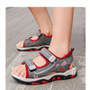 A close-up of gray and red breathable summer sport sandals for boys, showing the adjustable straps and sole.