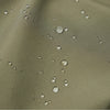 Close-up of a tan fleece fabric with water droplets on it.