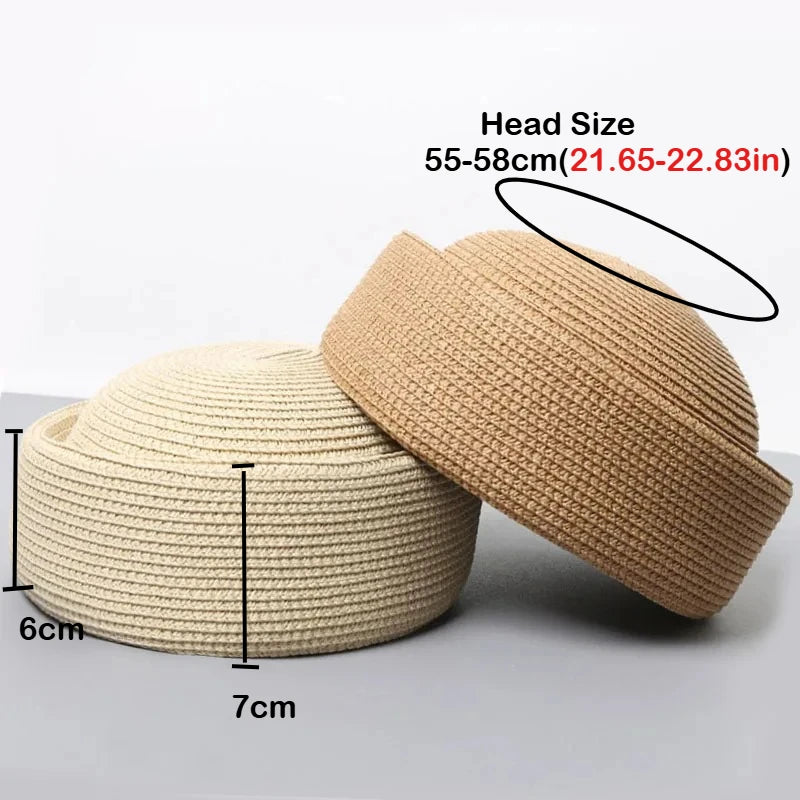 A beige straw pillbox sun hat is shown with measurements indicating its size and brim.
