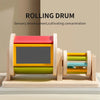 A wooden rolling drum toy with colorful spinning segments used for sensory development and concentration.