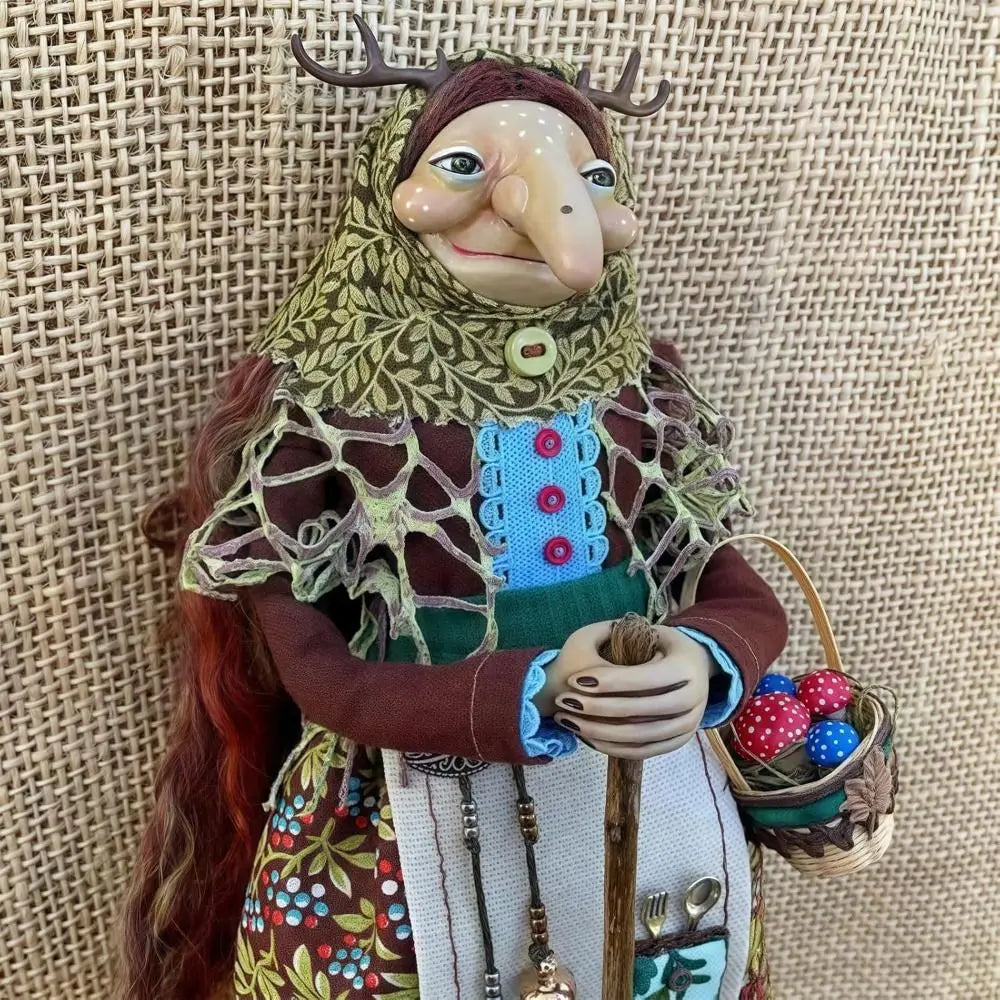 Handcrafted kitchen witch doll with antique charm featuring a horned face, green lace, and brown clothing.
