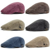 Cuatro vistas de una gorra estilo newsboy de mezclilla lavada con estilo boina retro en morado, marrón, verde oliva y azul.