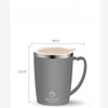 A matte grey stainless steel insulated travel mug with a handle, shown in a side view.