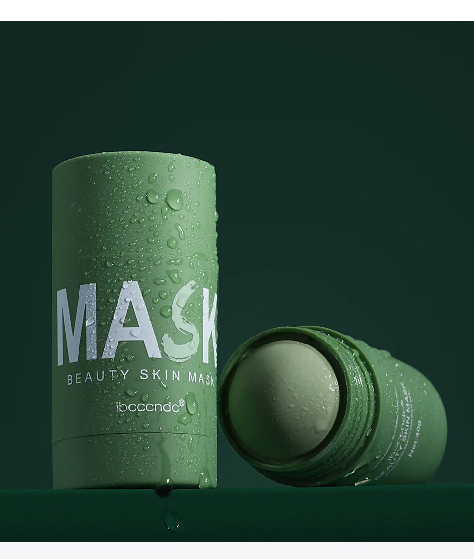 A tube of green tea cleansing stick mask with a green product visible on the side.