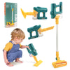 A collection of green and yellow kids' interactive toy vacuum cleaners, some assembled and one being used by a child.