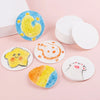 Round pieces of magic 3D puffy texture painting paper for kids in yellow, blue, and orange colors