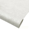 Roll of vintage floral textured faux leather fabric for handcrafted projects in white