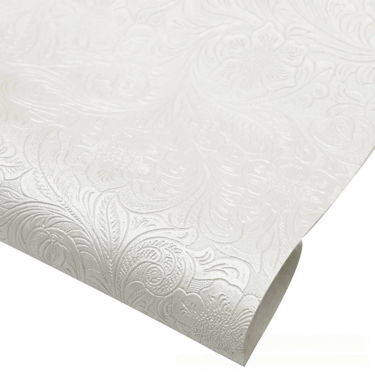 Roll of vintage floral textured faux leather fabric for handcrafted projects in white