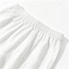White linen drawstring capri pants shown flat lay with elastic waistband
