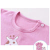 Pink short-sleeve t-shirt and shorts set with a white dinosaur print
