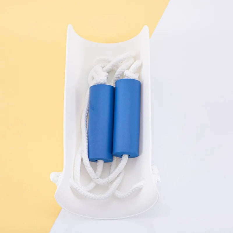 A white tray holds two blue rolled socks with white string for easy application.