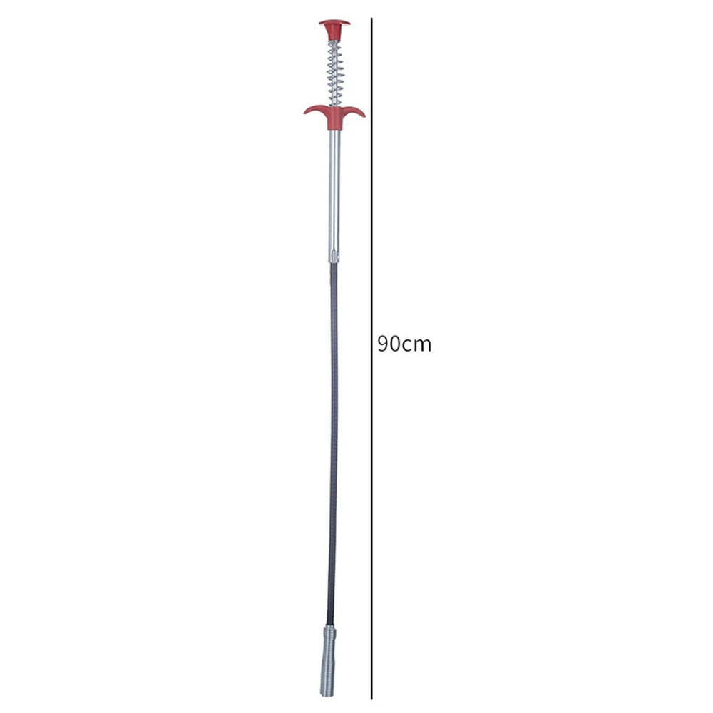 A long, thin drain snake tool with a red handle and silver shaft.