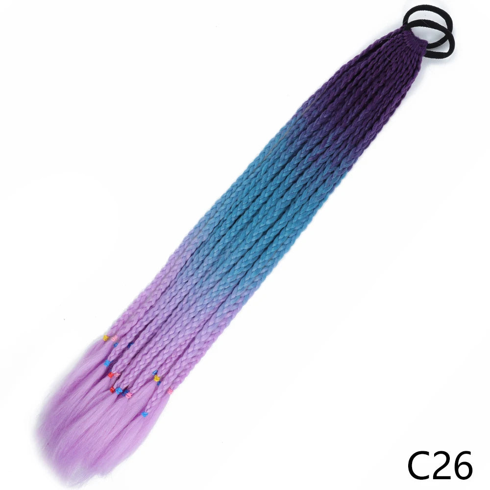 A gradient purple to blue hair extension ponytail with an elastic band.