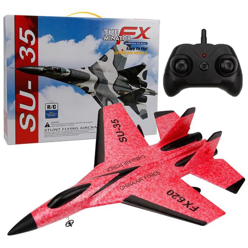 A red and black foam glider model of the SU-35 fighter jet is shown next to its packaging box.