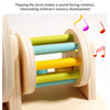 Montessori wooden spinning drum with colorful wooden rods for auditory training and sensory development.