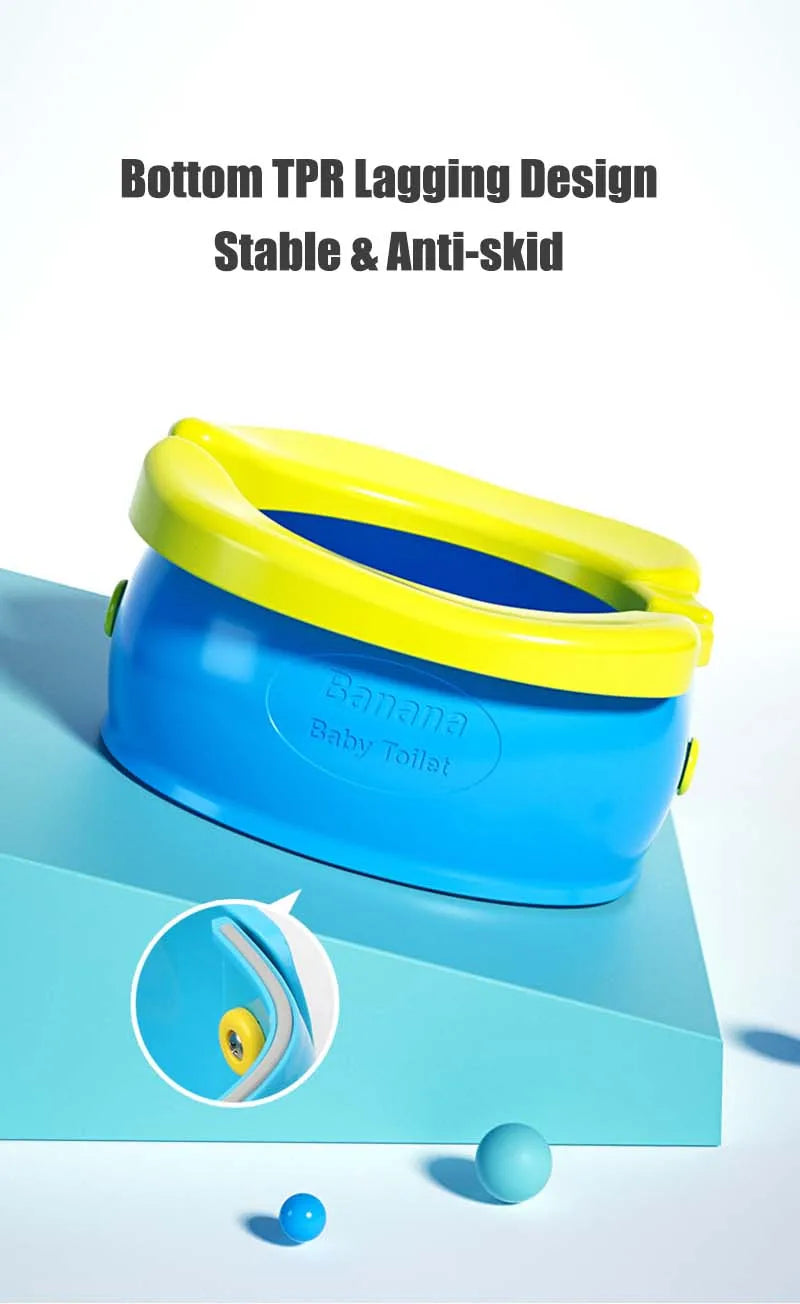Blue Banana Baby Toilet with yellow rim and green lid shown on a light blue surface.
