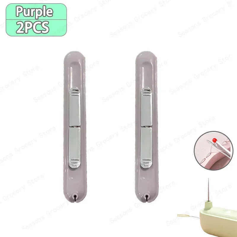 A pair of purple needle threader and seam ripper tools shown in a vertical orientation.